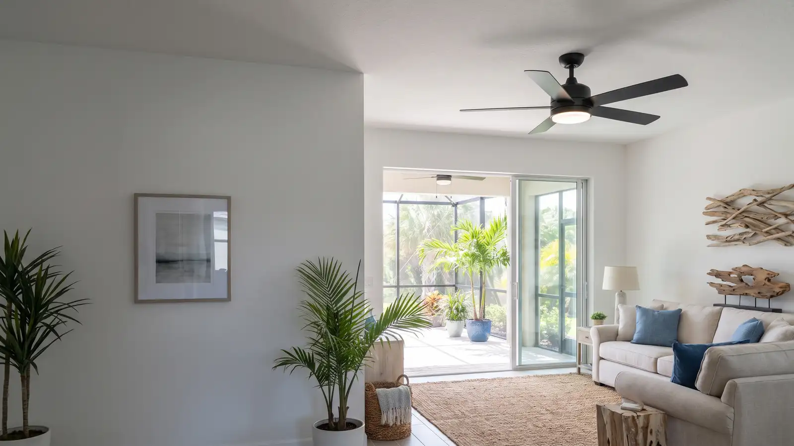 Modern ceiling fan with a light kit installed in a bright Florida living room