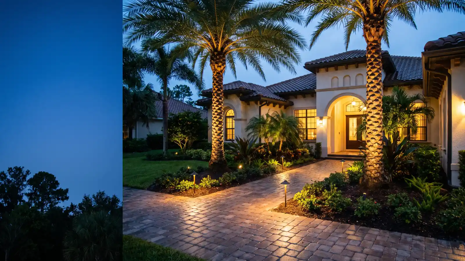 Florida home at dusk with path lights and palm uplighting